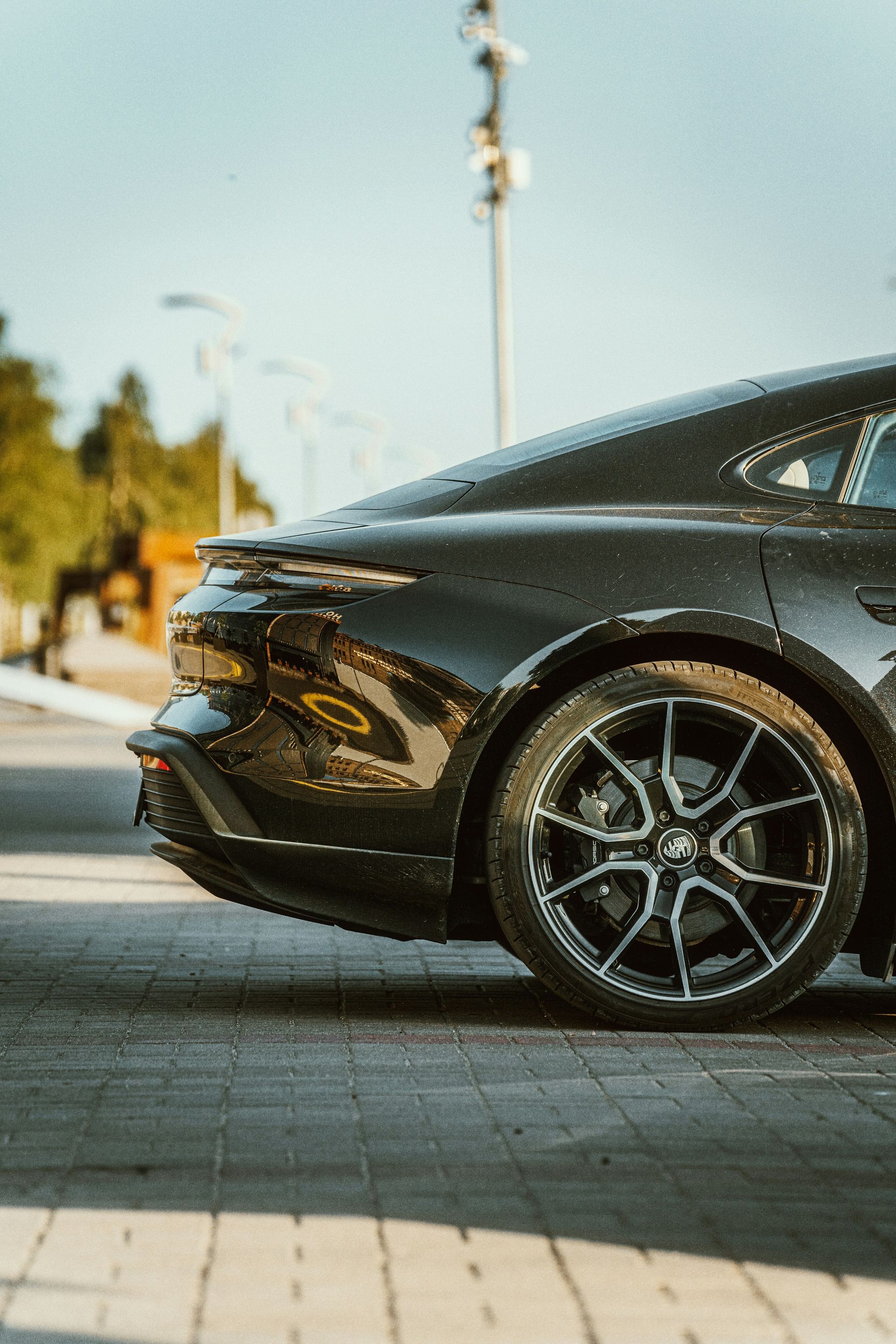 a black sports car parked on the side of the road